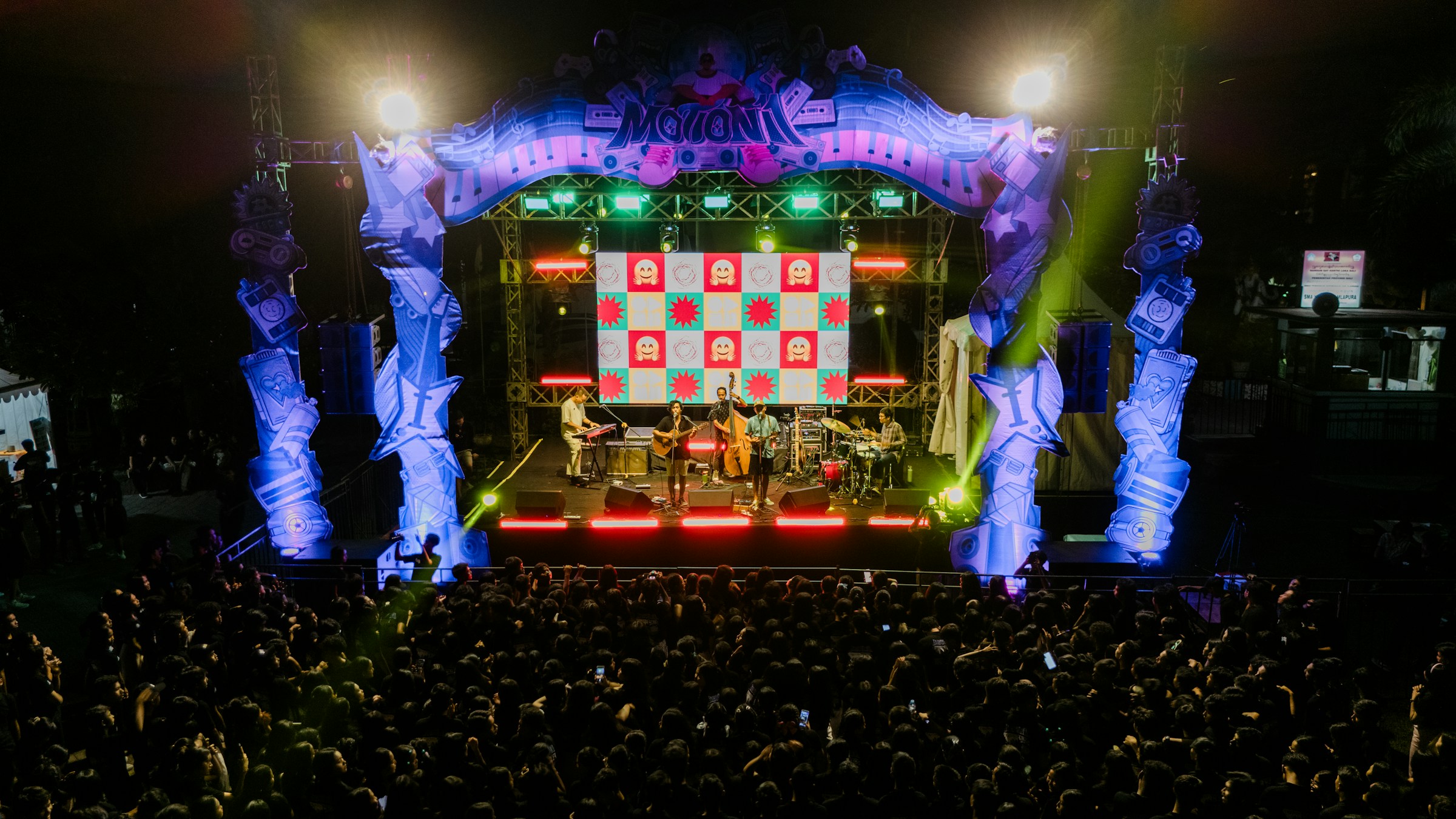 Drone-shot concert stage and audience; illustrative stock photograph