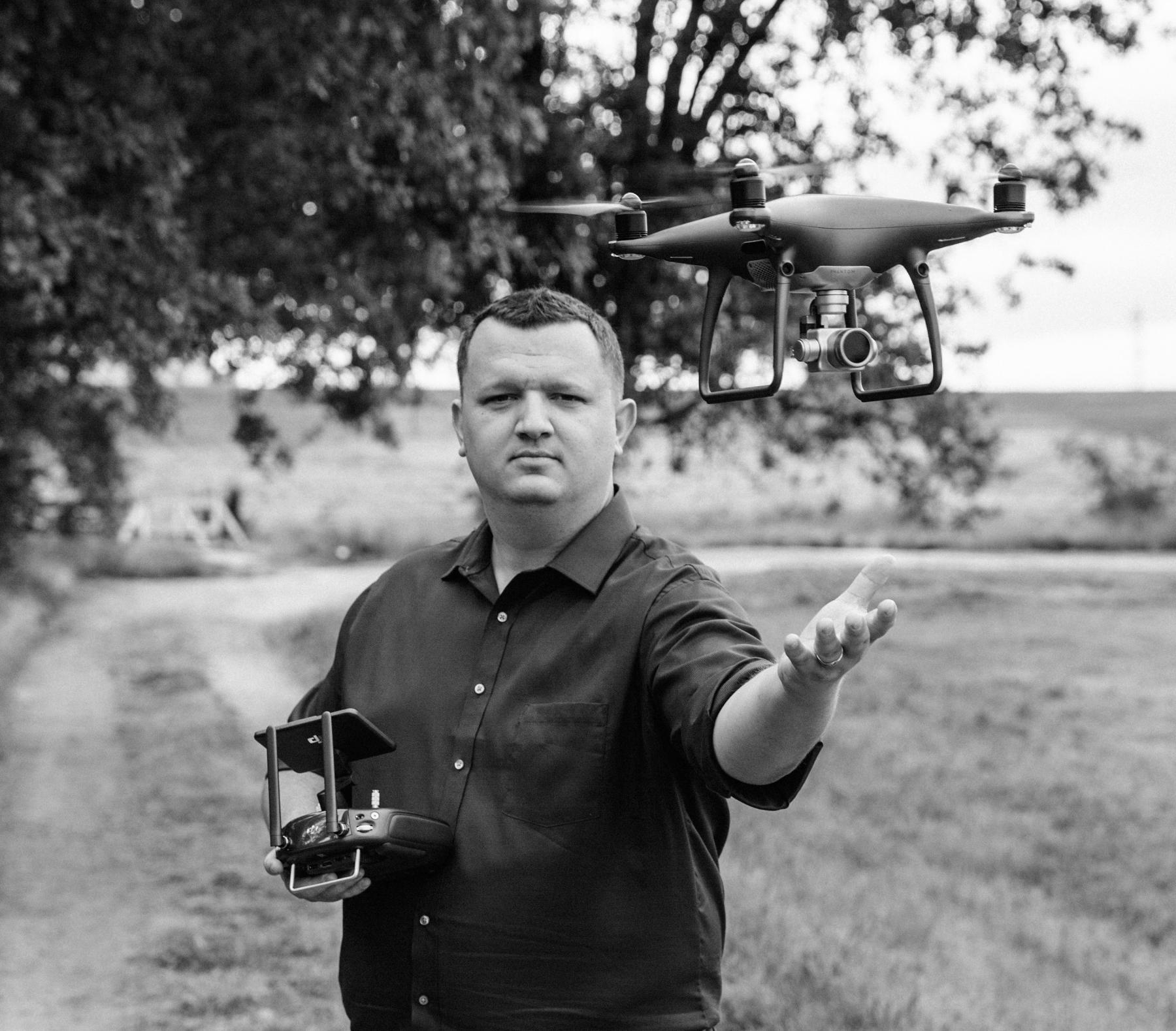 California Phantom photographer outdoors beside a hovering drone